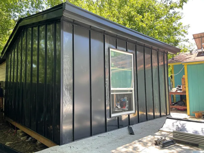 Black standing seam metal wall panels for Roof Inspection in Sheboygan Falls