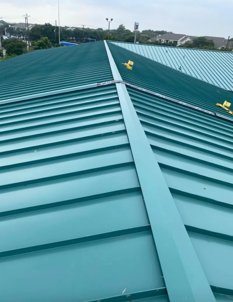 Green commercial metal roof ridge and valley for Metal Roof Repair in Sheboygan Falls